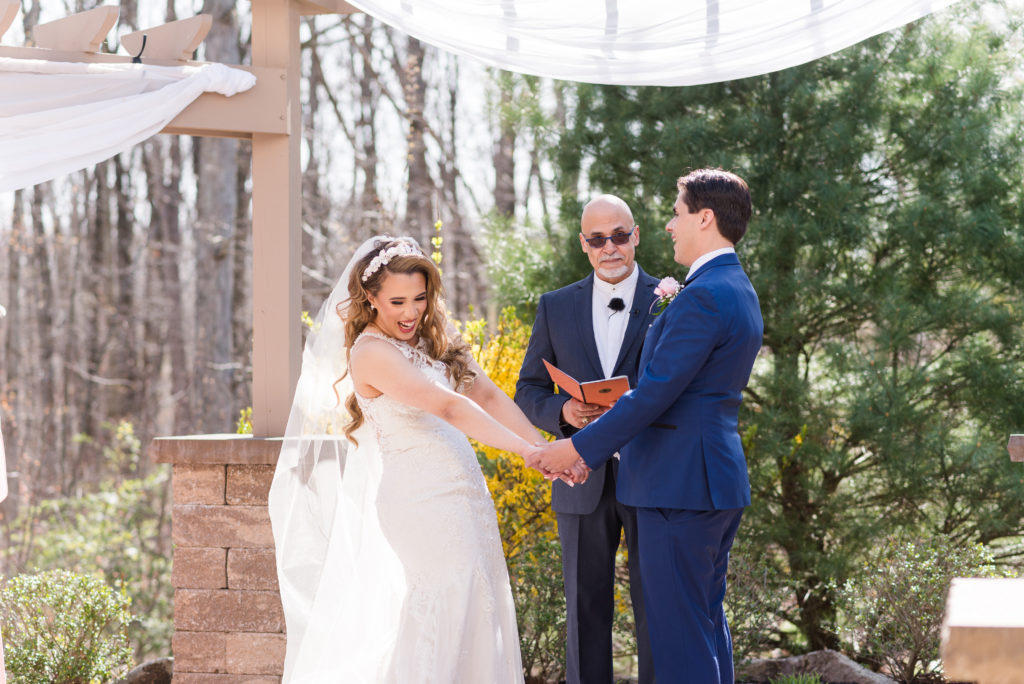 Laughter between Bride and Groom during their wedding ceremony at Sands Springs Country Club. 